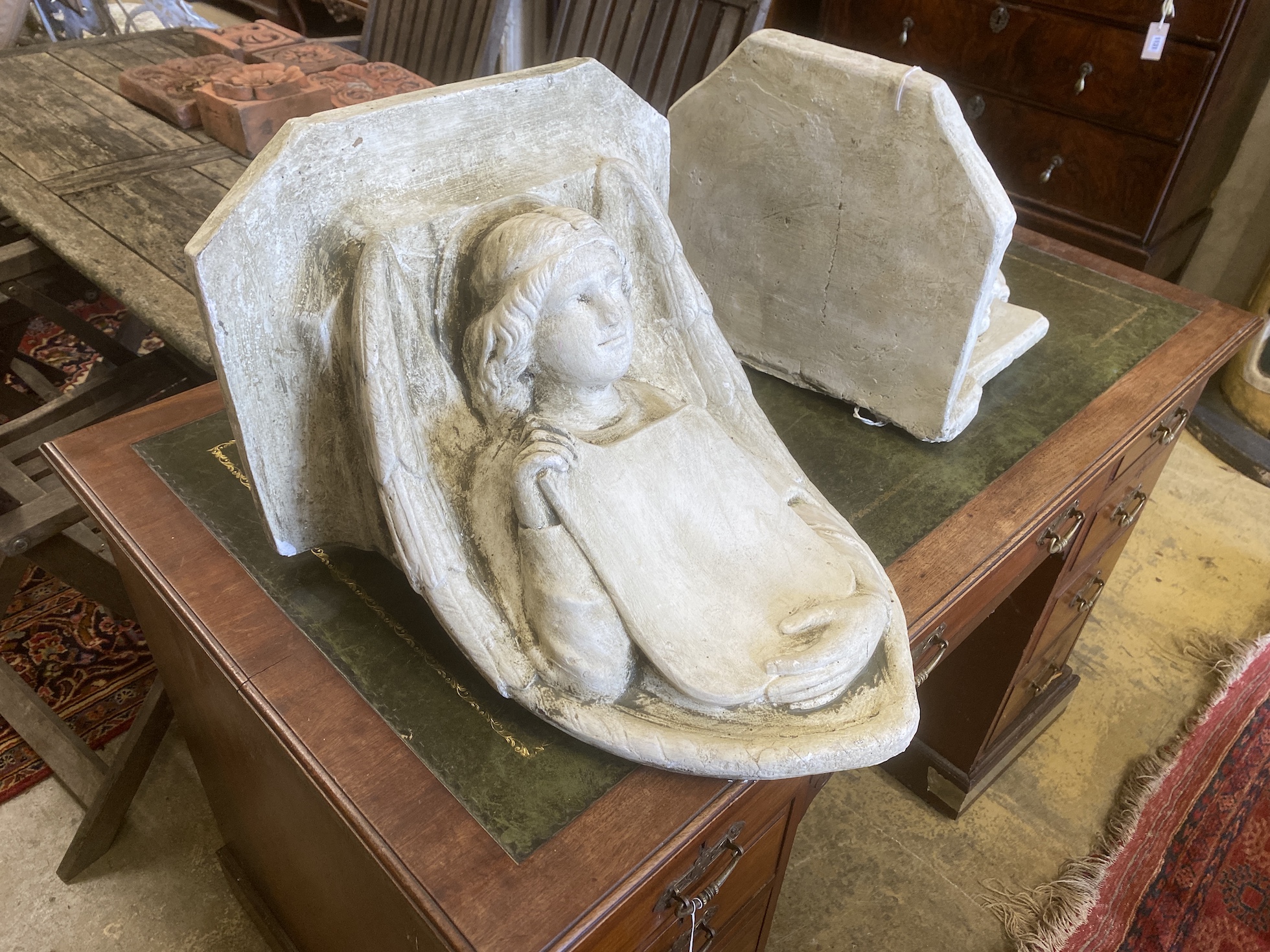 Two painted plaster wall brackets, larger width 42cm, height 44cm